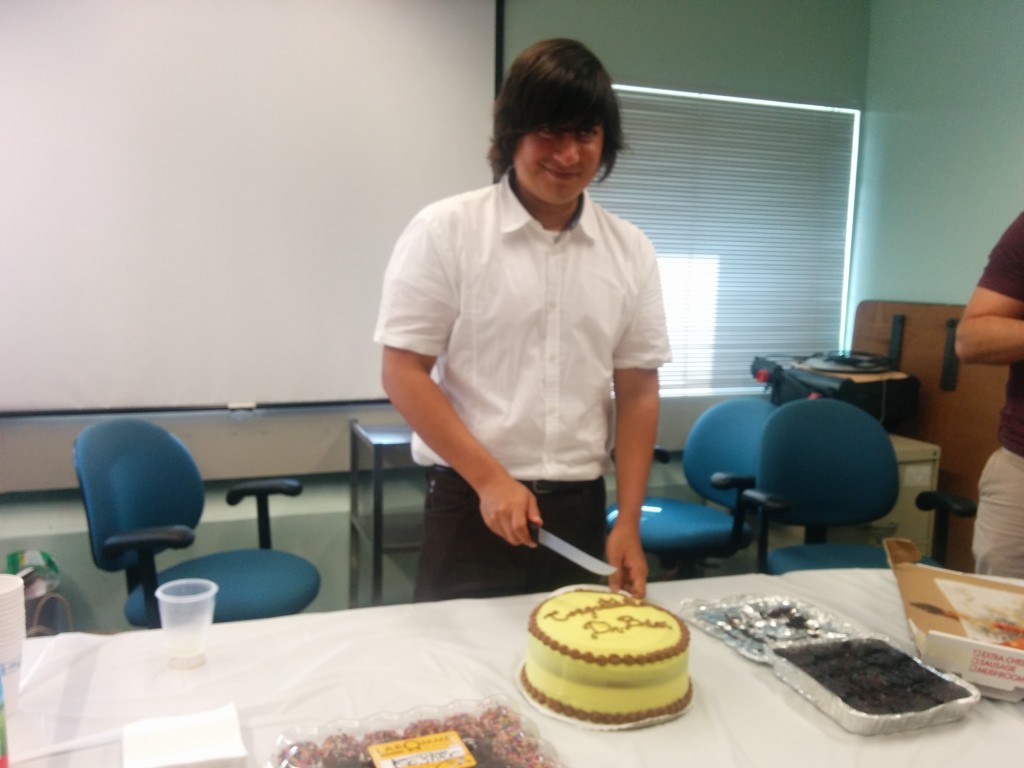 Brian cutting cake